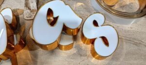 Golden trim cap 3D letters